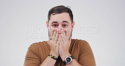 Buy stock photo Surprise, cover mouth and man in studio for wtf, secret and fear on white background space. Wow, portrait and shocked person with face expression for fake news, danger or scared with horror story