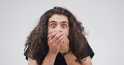 Buy stock photo Shock, cover mouth and man in studio for wtf, terror and fear on white background space. Wow, surprise and portrait of person with face expression for fake news, danger or scared with horror story