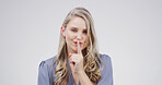 Happy, portrait and woman in studio with privacy, gossip or confidential hand gesture for secret. Quiet, smile and female person with finger on lips for silence or noise control by white background.