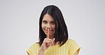 Portrait, student and woman with secret, mysterious and gesture for privacy, confidential or studio. White background, shush and person with sign for silence, pupil and finger for shut up or reaction