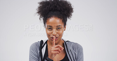Buy stock photo Black woman, portrait and finger with hush, studio and silence for mystery announcement. Model, gossip and secret with rumor, whisper and gesture for news, opinion and privacy on white background