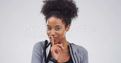 Buy stock photo Portrait, woman and finger on lips in studio for secret, quiet or privacy gesture for gossip. Happy, confidential and person from Mexico with silent hand sign for rumor or mystery by white background
