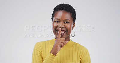 Buy stock photo Hush, portrait and silence with black woman on studio space for gossip, secret or privacy. Emoji, finger on lips and whisper with person isolated on white background for confidential information