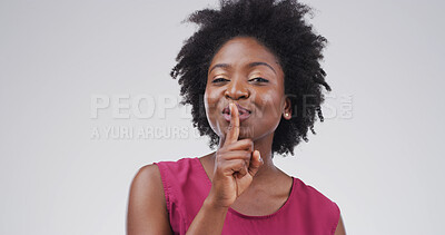 Buy stock photo Hush, portrait and whisper with black woman on studio space for gossip, secret or silence. Emoji, finger on lips and privacy with person isolated on white background for confidential information
