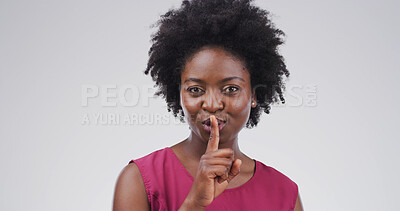 Buy stock photo Hush, portrait and privacy with black woman on studio space for gossip, secret or silence. Emoji, finger on lips and whisper with person isolated on white background for confidential information