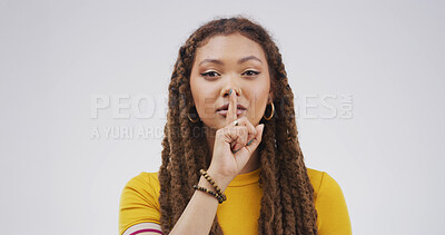 Buy stock photo Portrait, finger on lips and woman with secret, whisper and privacy sign on white studio background. Shush, hand gesture and person with mystery news, silence and emoji with gossip and confidential