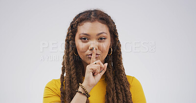 Buy stock photo Portrait, finger on lips and woman with privacy, whisper and silent sign on white studio background. Emoji, gesture and person with mystery news, shush or noise control with gossip and confidential