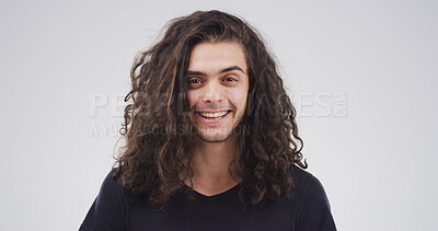Buy stock photo Portrait, man and smile with messy hair in studio for natural growth, frizz problem and dry texture. Space, male person or tangle of curly hairstyle, split ends and salon disaster on white background