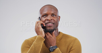 Buy stock photo Phone call, planning and thinking with black man on studio space for negotiation or networking. Communication, conversation and ideas with person isolated on white background for mobile feedback