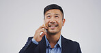 Businessman, phone call and smile in studio with thinking, mockup space and portrait on white background. Asian person, lawyer and attorney with smartphone for legal consultation, advice and decision