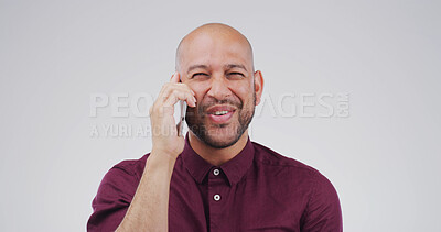 Buy stock photo Phone call, smile and man talking in studio for communication, update or listening. Contact, conversation and person with mobile connection for info, advice or response on white background with space