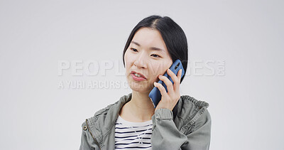 Buy stock photo Phone call, studio and Asian woman with contact for communication, update or listening. Conversation, person and mobile for connection, advice or talk for information on white background with space