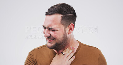 Buy stock photo Sick, sore throat and man in studio with flu, cold or allergies by mockup space for respiratory disease. Illness, asthma and male person with tuberculosis, virus or infection by white background.