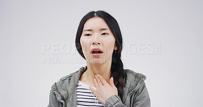 Buy stock photo Asian woman, sore throat and pain with hand on neck for breathing, tonsillitis or enlarged adenoids. Sick person, studio and infection symptom of flu, thyroid or pharyngitis on white background
