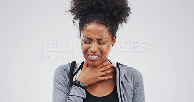 Buy stock photo Upset, sick or black woman with itchy throat on studio space for cold, sore voice or virus symptoms. Dry, choke or person on white background with flu allergy, thyroid inflammation or neck injury