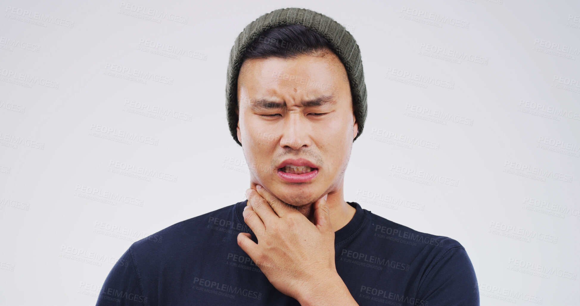 Buy stock photo Studio, choke or Asian man with throat pain for cold, flu or virus symptoms on white background. Space, sick or male person isolated with uncomfortable sore neck, thyroid inflammation or asthma risk