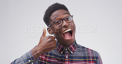 Buy stock photo Excited, portrait or black man with thumbs up in studio for vote approval, positive feedback and yes. Mockup, happy and person with like emoji for successful review and good job on white background