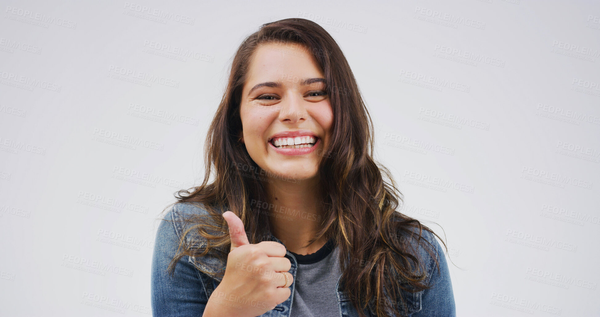 Buy stock photo Positive, portrait or woman with thumbs up in studio for vote support, agreement and good job. Mockup space, person and like emoji on white background for celebration, confirmation or excellence sign