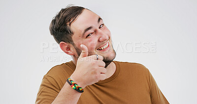 Buy stock photo Happy, portrait and man with thumbs up in studio for vote approval, positive feedback and yes sign. Mockup, pride and person with like emoji for confirmation good job and support on white background