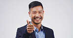 Happy man, portrait or thumbs up in studio for good job, success or OK on a white background. Face, businessman or model with smile, like emoji or yes sign for welll done or thank you on mockup space