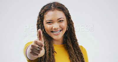 Buy stock photo Portrait, happy woman and thumbs up in studio for success, support or agreement. African model, smile and like hand gesture with emoji for feedback, excellence and winning on white background space