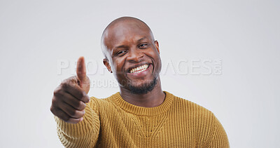 Buy stock photo Happy, black man or portrait with thumbs up in studio for success or good job on a white background. Face, male person or African model with smile, like emoji or yes sign for welll done or thank you
