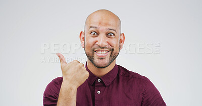Buy stock photo Happy man, portrait and pointing with surprise in studio for advertising on a white background. Male person, model or smile with decision, choice or selection for marketing or list on mockup space