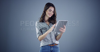 Buy stock photo Intern, tablet and reading with woman in studio for social media, branding and communication. Learning opportunity, campaign research and online launch with person on background space for startup