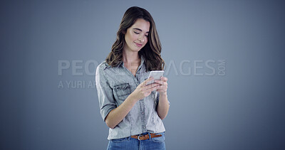 Buy stock photo Intern, phone and reading with woman in studio for social media, branding and communication. Learning opportunity, campaign research and online launch with person on background space for startup