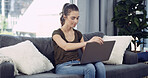 Laptop, relax and woman on sofa in home with remote work for creative project online in living room. Freelancer research and female editor with computer for article publishing with email in apartment