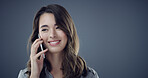 Happy woman, listening and phone call in studio for communication or reception on a blue background. Female person, secretary or smile with mobile smartphone for conversation or chat on mockup space