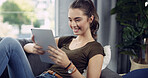 Tablet, happy and woman on sofa in home reading ebook, blog or research on app for weekend activity. Relax, calm and female person with digital technology for social media in living room at apartment