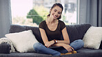 Portrait, woman and student with smile at house for education, comfortable and weekend break. Happy, female person and rest with laptop for learning, university scholarship and stress relief on couch