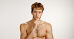 Skincare, serious and portrait of man in studio with beauty, natural or facial treatment for confidence. Mockup space, shirtless and person from London with dermatology routine by white background.