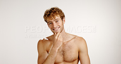 Buy stock photo Confident, man and smile for skincare, studio and dermatology for smooth skin, glow or mockup space. White background, portrait and facial treatment for person, shirtless and happy for beauty in USA