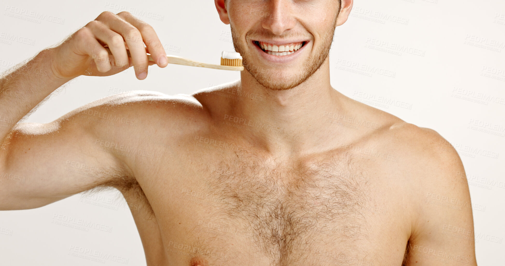 Buy stock photo Dental care, smile and man brushing teeth in studio for fresh breath, wellness or plaque removal. Morning, oral health and person with toothbrush for cleaning mouth with hygiene by white background.