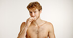Dental health, portrait and man brushing teeth in studio for fresh breath, wellness or plaque removal. Morning, hygiene and male person with toothbrush for cleaning mouth by white background.