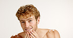 Facial, portrait and smile with man in studio for grooming, hygiene or wellness routine. Beauty, lotion and skincare with person on white background to apply face cream or moisturizer in bathroom