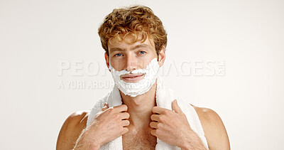Buy stock photo Portrait, shaving cream and man with towel, smile and grooming on white studio background. Face, person and model with beard care, epilation and wellness with hair removal, beauty and facial product