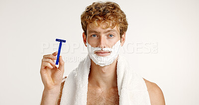 Buy stock photo Portrait, shaving cream and man with razor, towel and grooming on white studio background. Epilation, person and model with routine, beard care or wellness with hair removal, beauty or facial product