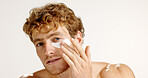 Portrait, eye patches and man with skincare, beauty and dermatology on white studio background. Face, happy person and model with spa wellness, mask and facial with detox, treatment and cosmetics