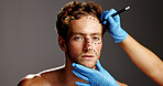 Beauty, plastic surgery and drawing with face of man in studio for prp, aesthetics and collagen. Planning, skincare and dermatology with person on gray background for facial, cosmetics and filler