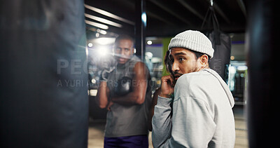 Buy stock photo Fitness, coach or teach defense in boxing with position, group session or training at punching bag. Man, trainer or athletes in gym for instruction, combat technique or learning with sports challenge