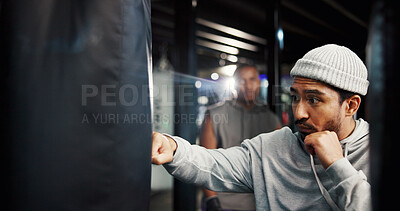 Buy stock photo Man, punching bag and coach for training at gym with power, challenge and martial arts. Person, athlete and workout with mentor for fight, contact sports and equipment with exercise at boxing club