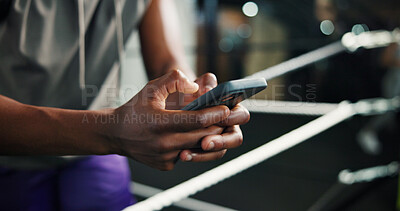 Buy stock photo Fitness, man hands and phone in boxing ring for contact, training schedule or typing message on break. Boxer, rest and mobile at gym for social media, status update and online post on exercise forum