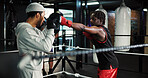 Fitness, teamwork and training with people in boxing ring for combat, self defense or sparring. Boxer, challenge and fight with men punching in gym for competition, exercise or performance as athlete