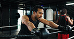 Fitness, boxing ring and tired man on rope for rest, relax and health recovery for intense exercise. Athlete, boxer and break in gym with breathing, fatigue and sweat for fight challenge with sport