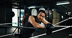 Sport, boxing ring and tired man on rope for relax, rest and health recovery for intense exercise. Athlete, boxer and break in gym with breathing, fatigue and sweat for fight challenge with fitness