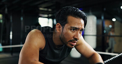 Buy stock photo Breathing, sweating and tired with man in boxing gym for break, recovery or rest from training. Fatigue, fitness and exercise with exhausted boxer in health club for challenge or intense workout