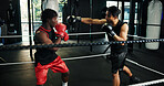 Combat, sports and training with people in boxing ring for fitness, self defense or sparring. Boxer, challenge and fight with men punching in gym for competition, exercise or performance as athlete